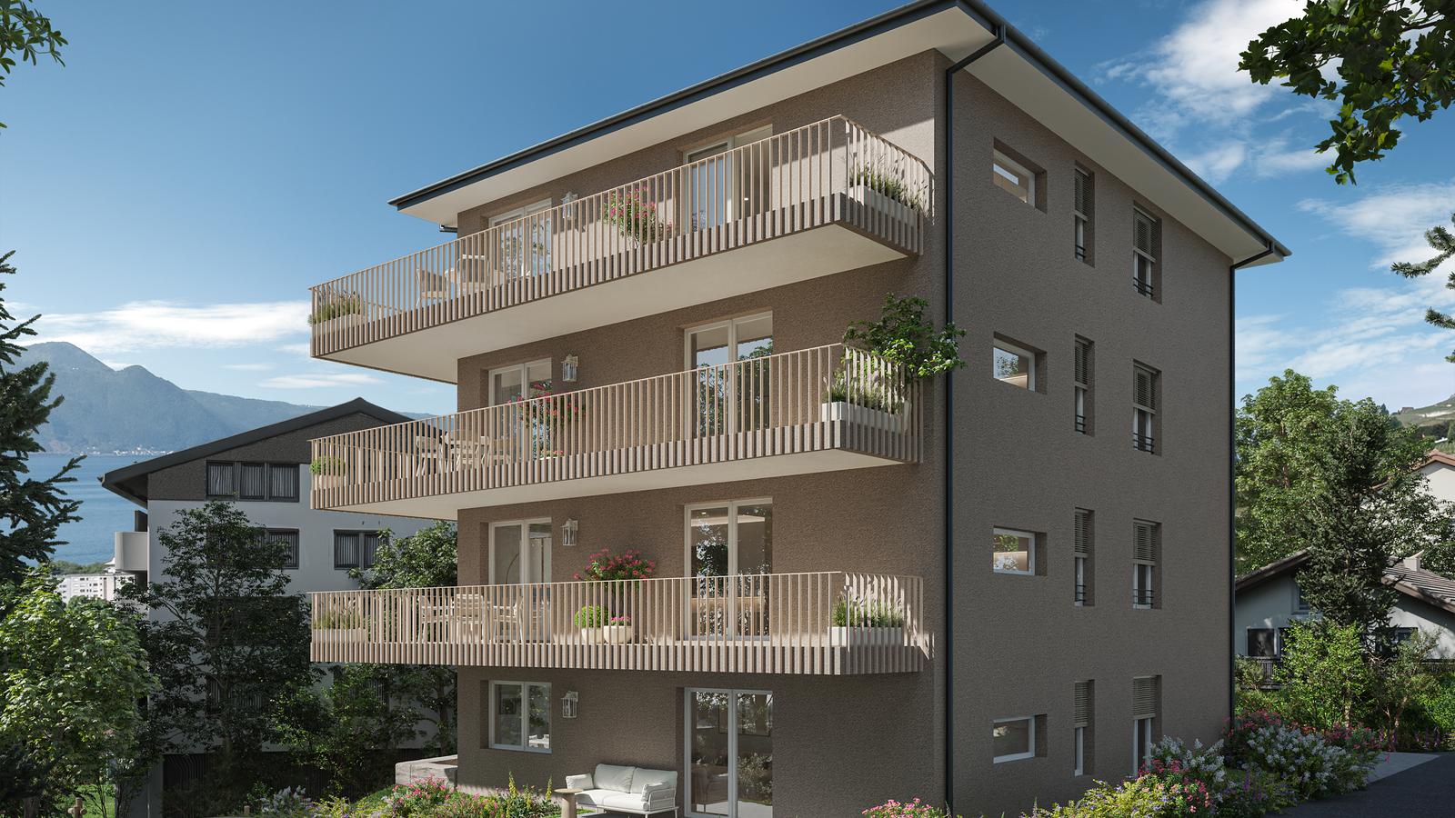La résidence Terralys vue de trois quarts, ses balcons ouverts sur le Léman et les Dents du Midi